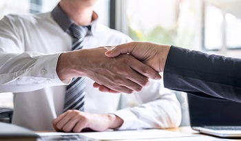  A handshake between an advisor and his client.