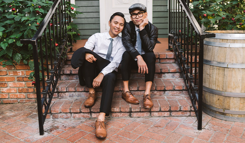Couple sitting on stairs.