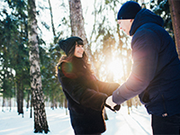 Couple in a snowy forest.