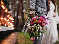 Newlyweds and wedding bouquet.