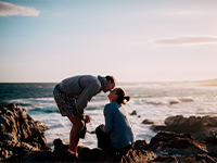 Happy couple in their 40s kissing.